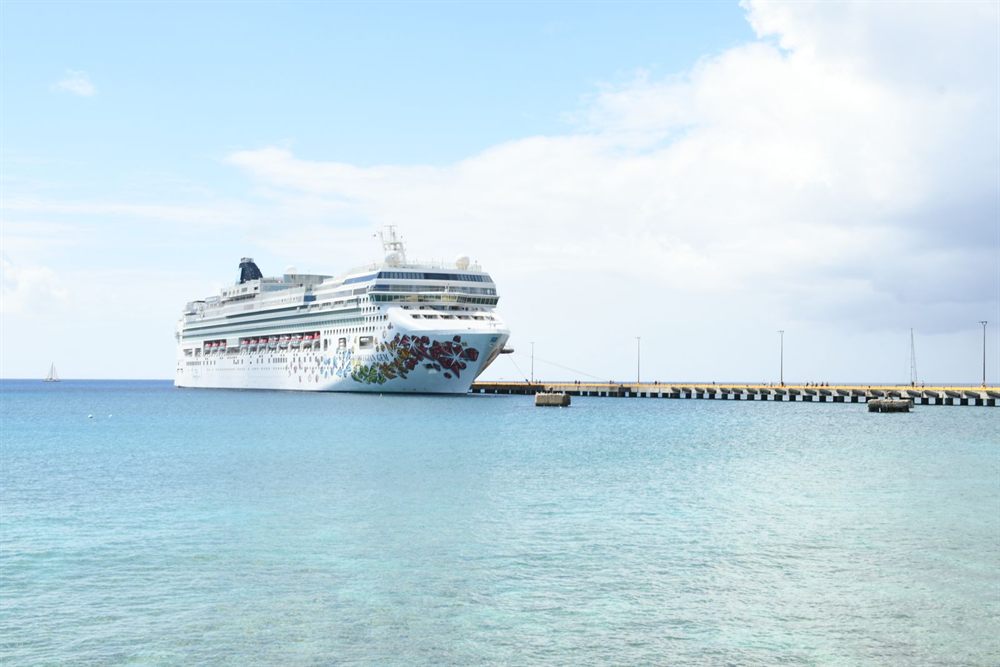 Cruise ship moored at a long pier in turquoise water off St. Croix